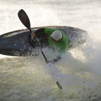 Surf Kayak Launching off the lip in Steamer Lane, Santa Cruz California